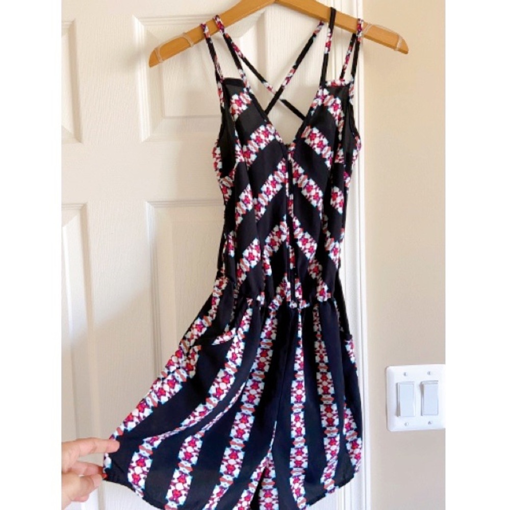 Navy blue and eclectic pattern cross strap romper